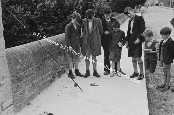 PSI OUTING GROUP OF BOYS WITH EEL